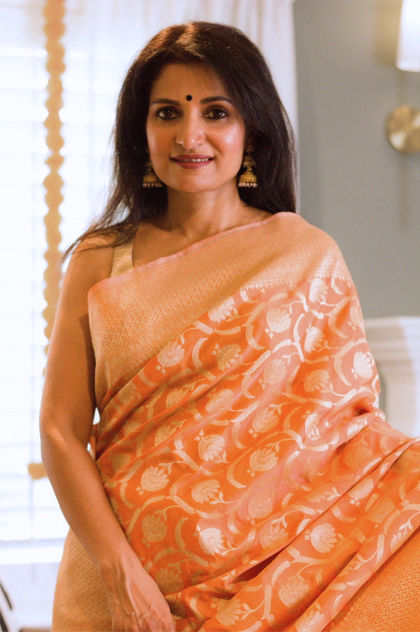 Apricot Pure Katan Silk Saree with Jangla Pattern And Kadhiyal border.