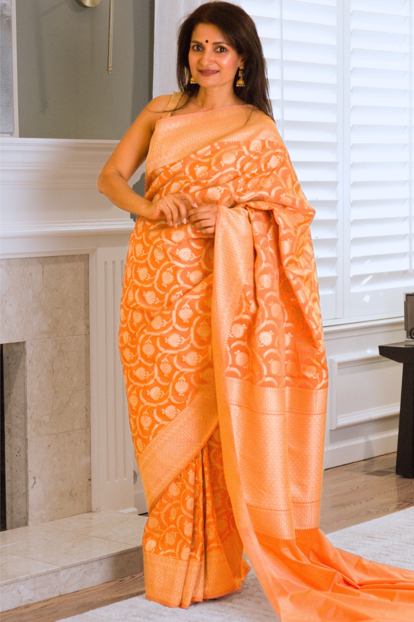 Apricot Pure Katan Silk Saree with Jangla Pattern And Kadhiyal border.