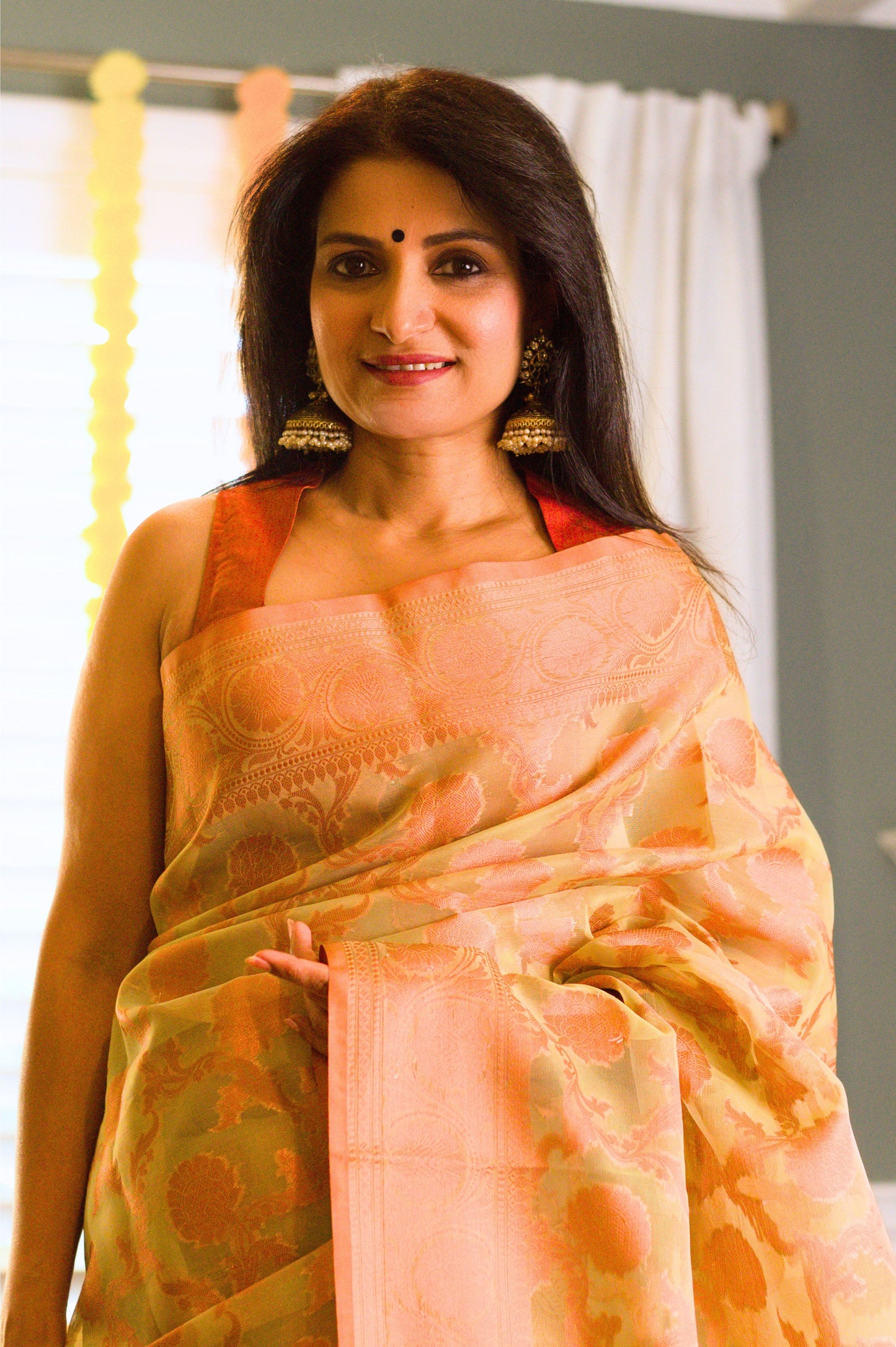 Green Banarasi Organza Saree with Copper Zari Border and Pallu.