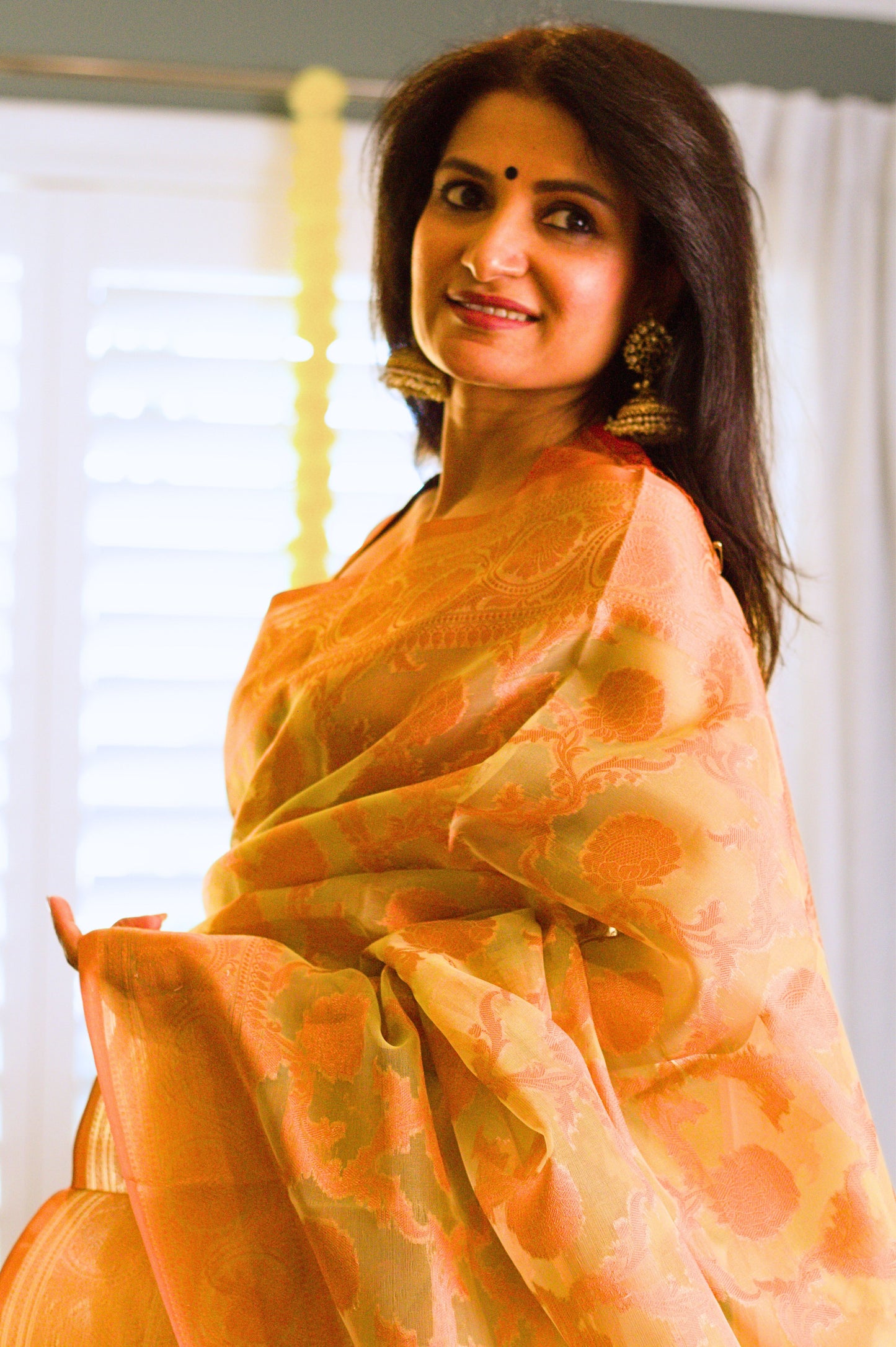 Green Banarasi Organza Saree with Copper Zari Border and Pallu.