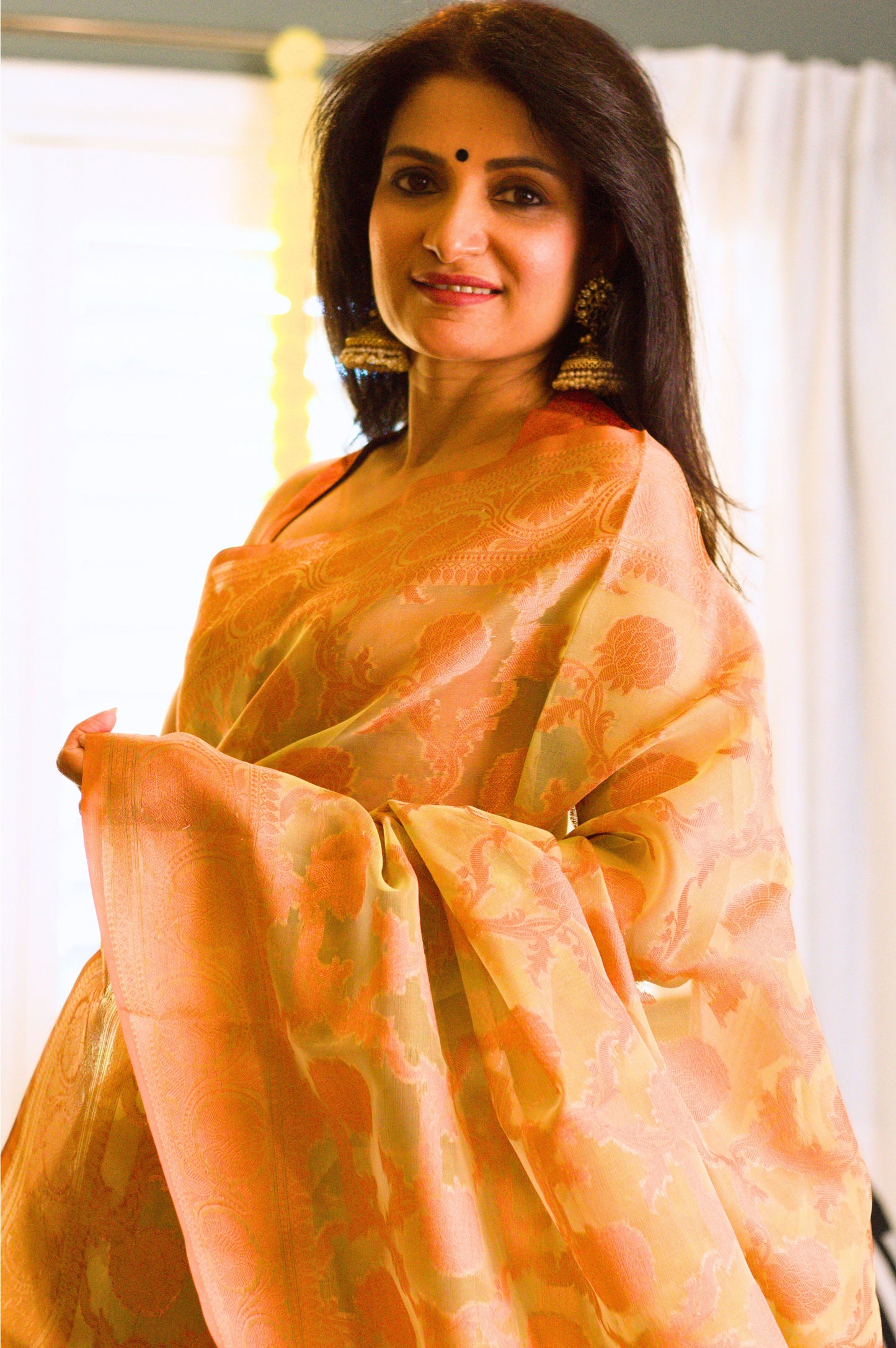 Green Banarasi Organza Saree with Copper Zari Border and Pallu.