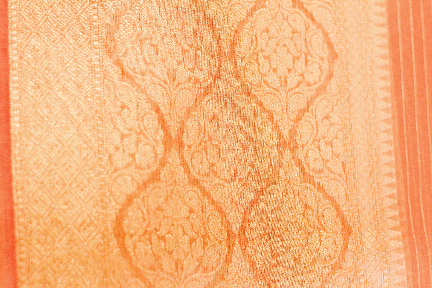 Rust Pink Pure Banarasi Organza Saree With Woven Gold Pin Stripes and a Wide Jari border.