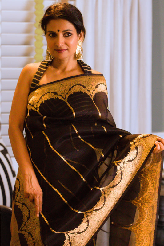 Black Kora Silk Banarasi Handloom Saree With Scallop Border and Stripes In Gold Zari.