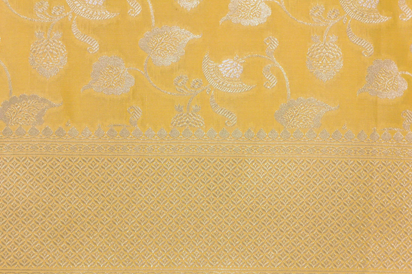 Buttery Lemon Pure Katan Silk Saree with Jangla Pattern And Kadhiyal border.