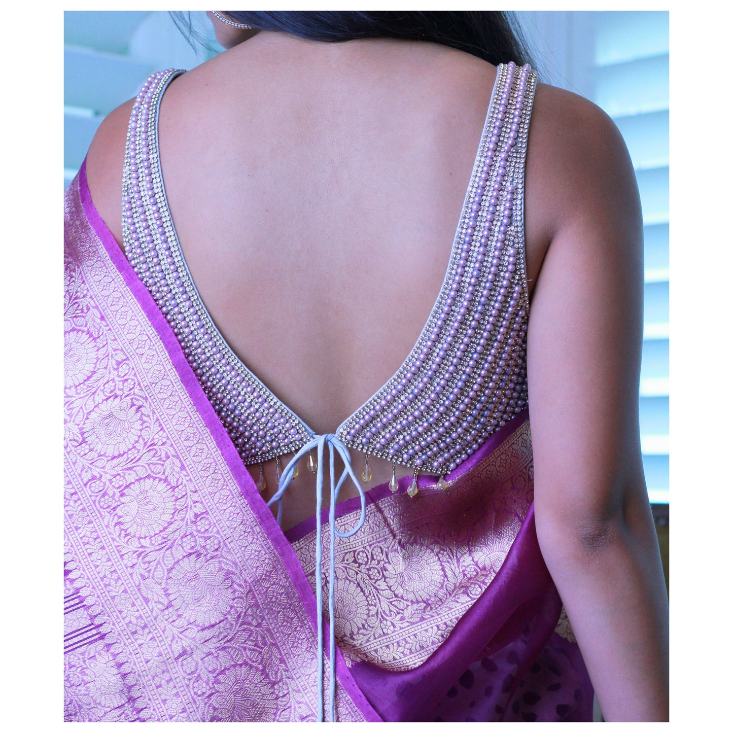 Mauve Sleeveless Pearl and Stone Saree blouse.