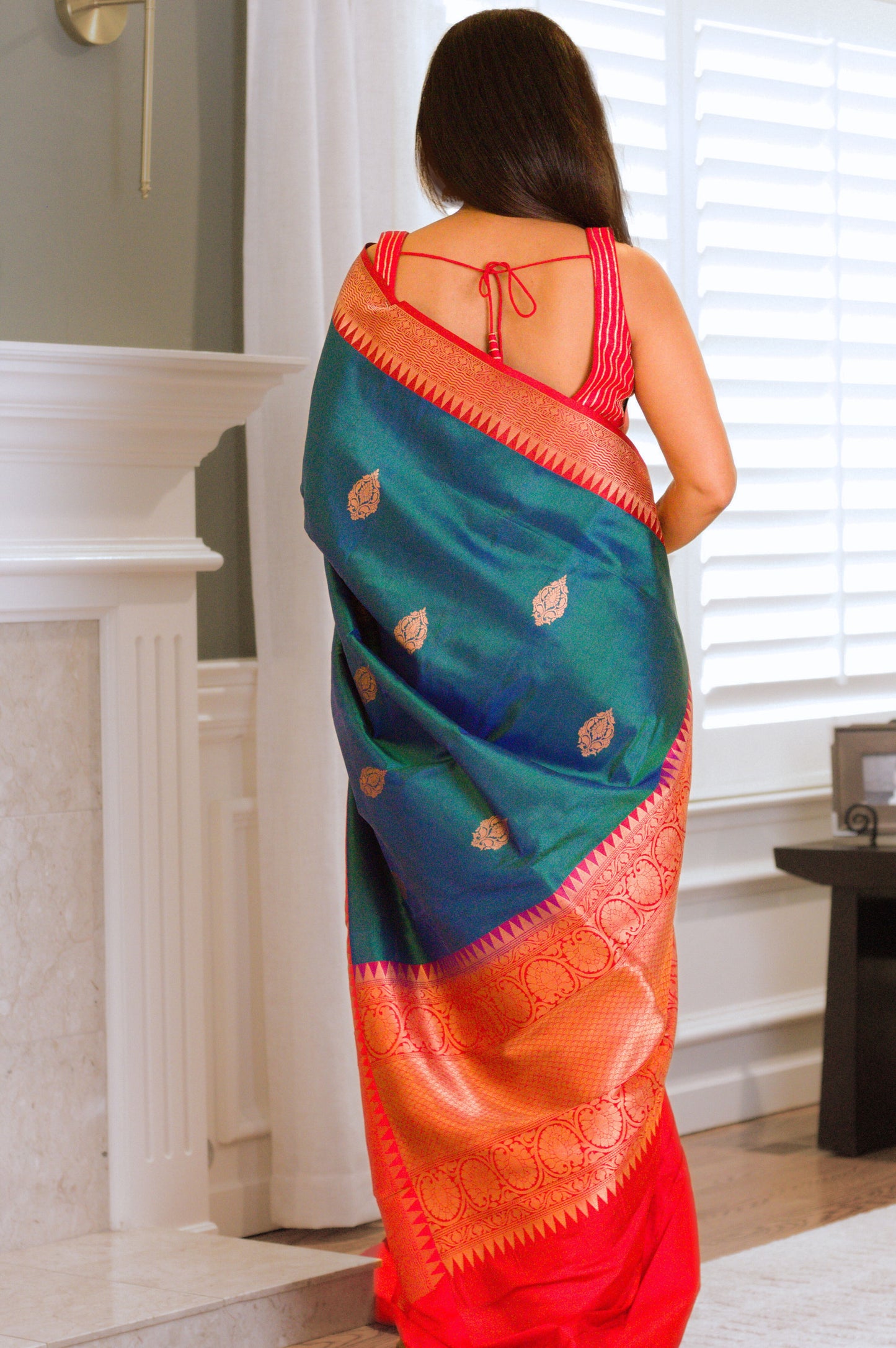Iridescent Peacock Blue Banarasi Pure Katan Silk Saree With Red Border and Subtle Gold Jari