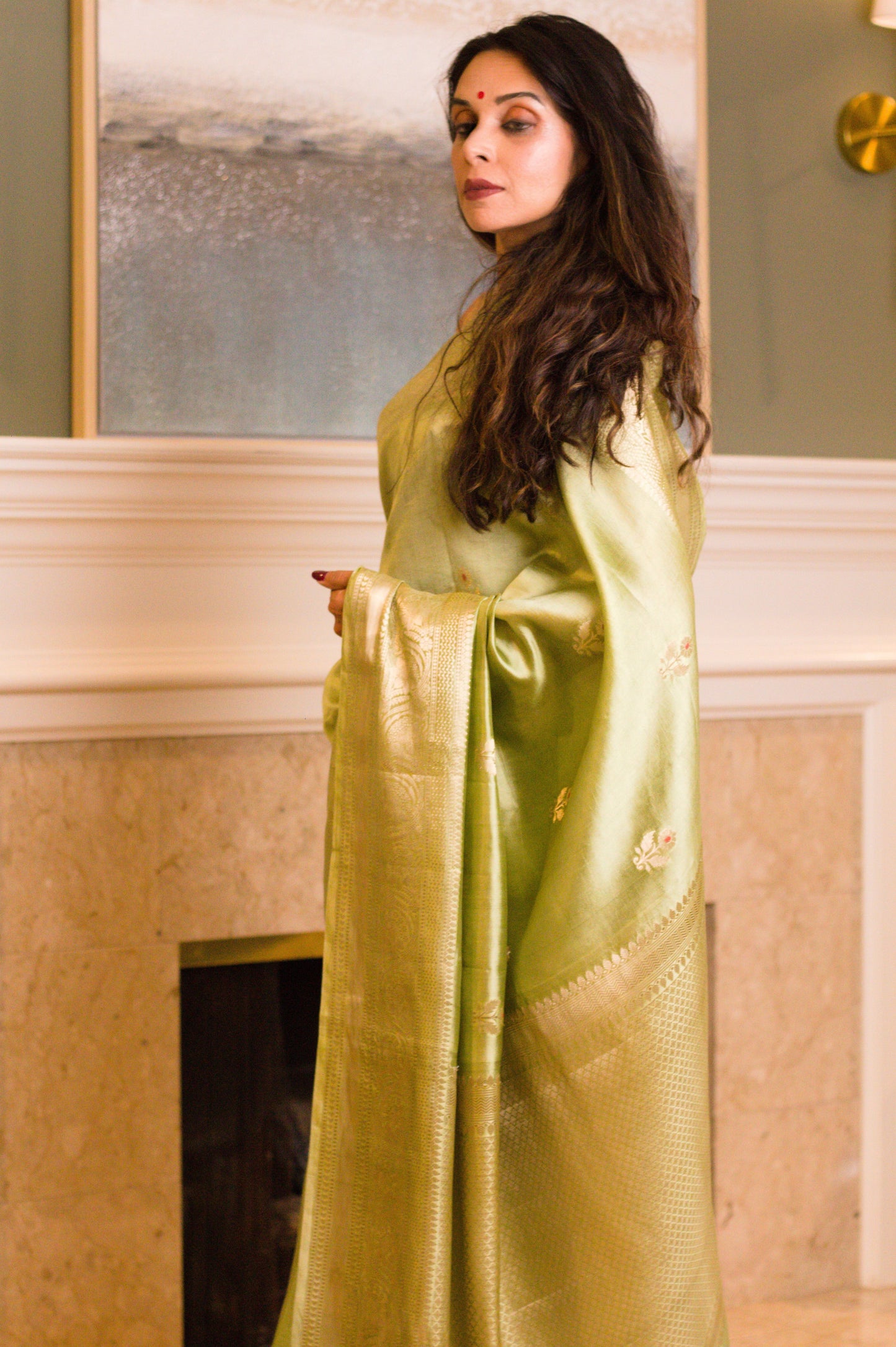 Light-Weight Pearlescent Green Pure Katan Silk Banarasi Handloom Saree with All Over Kadhwa Motifs and Intricate Bel Border in Subtle Gold Jari.