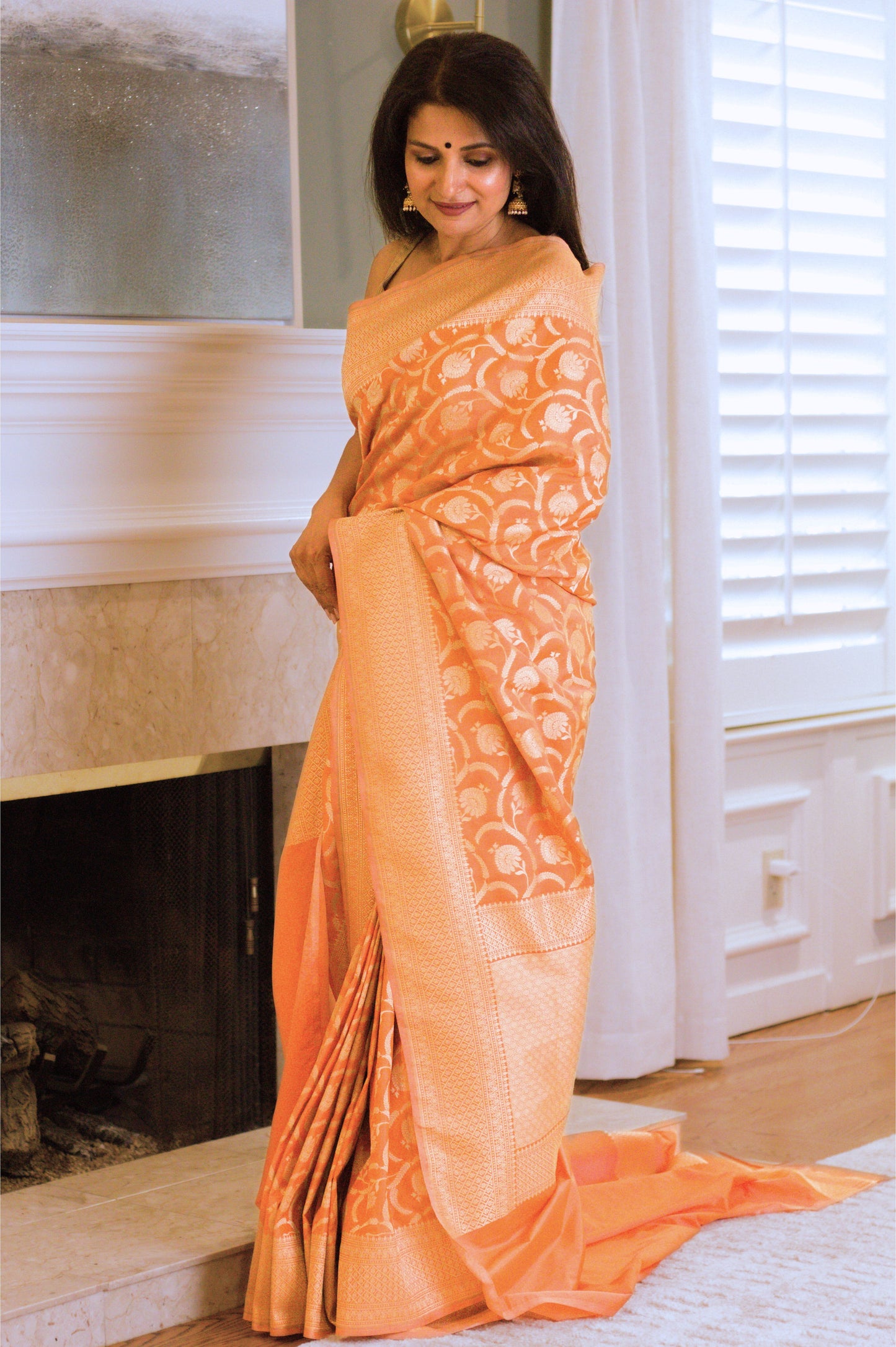 Apricot Pure Katan Silk Saree with Jangla Pattern And Kadhiyal border.